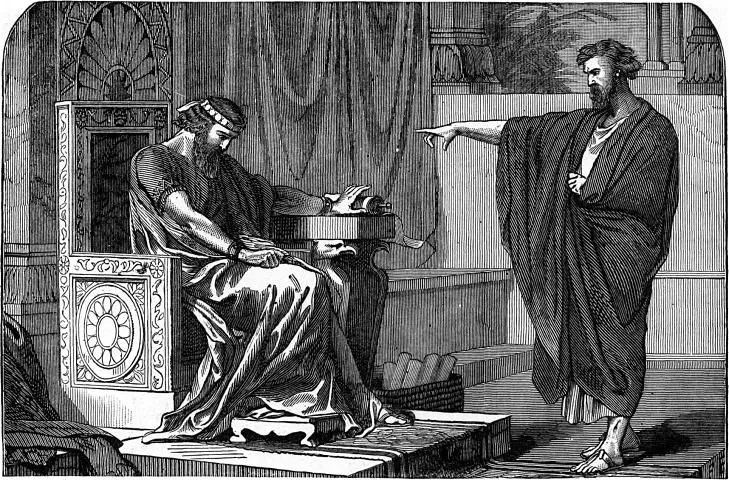 A man sitting on a throne holds his head, while another man standing in front of him points and speaks, with a background of elaborate architecture.